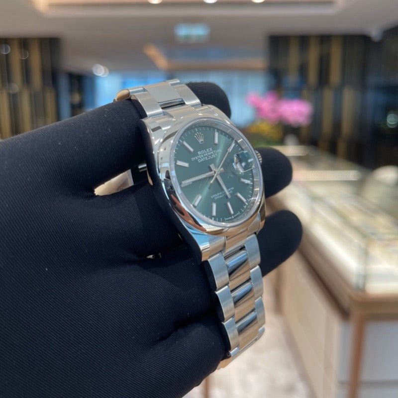 Rolex 126200 Green Oys Datejust- Aristo Watch & Jewellery